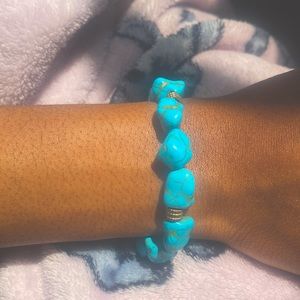 Turquoise marble crystal beads with gold spacers in the middle. Home made!